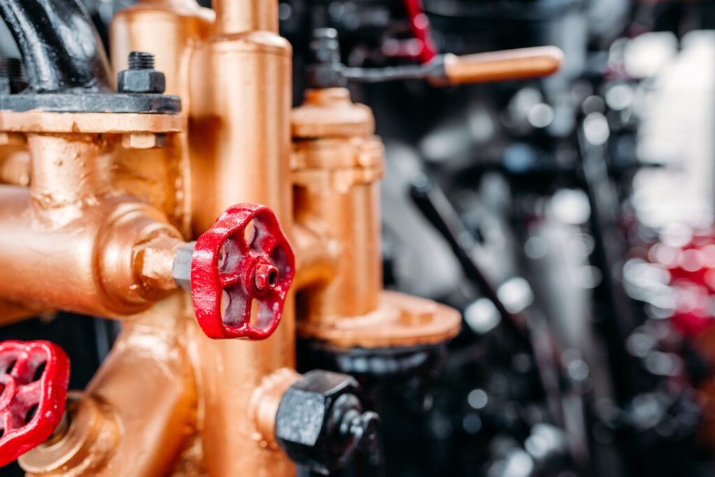 Old steam train cabine, valves, pipes closeup