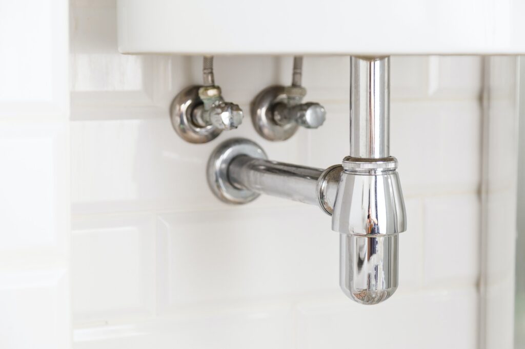 Basin siphon or sink drain in a bathroom, clean